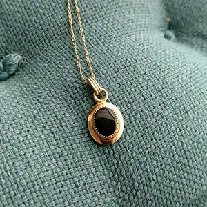 Gold and onynx pendant